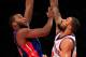 NEW YORK, NY - JANUARY 31: Greg Monroe #10 of the Detroit Pistons shoots over Tyson Chandler #6 of the New York Knicks at Madison Square Garden on January 31, 2012 in New York City. NOTE TO USER: User expressly acknowledges and agrees that, by downloading and or using this photograph, User is consenting to the terms and conditions of the Getty Images License Agreement. (Photo by Chris Trotman/Getty Images)