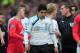 MANCHESTER, ENGLAND - FEBRUARY 11: Luis Suarez of Liverpool walks off for half time as Wayne Rooney of Manchester United talks to referee Phil Dowd during the Barclays Premier League match between Manchester United and Liverpool at Old Trafford on February 11, 2012 in Manchester, England. (Photo by Shaun Botterill/Getty Images)