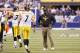 INDIANAPOLIS, IN - SEPTEMBER 25: Ben Roethlisberger #7 of the Pittsburgh Steelers walks off the field in front of head coach Mike Tomlin after throwing an interception against the Indianapolis Colts at Lucas Oil Stadium on September 25, 2011 in Indianapolis, Indiana. The Steelers won 23-20. (Photo by Joe Robbins/Getty Images)