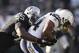 OAKLAND, CA - JANUARY 01: Curtis Brinkley #44 of the San Diego Chargers is tackled by Rolando McClain #55 of the Oakland Raiders at O.co Coliseum on January 1, 2012 in Oakland, California. (Photo by Ezra Shaw/Getty Images)