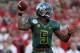 PASADENA, CA - JANUARY 02: Quarterback Darron Thomas #5 of the Oregon Ducks is looking to pass while taking on the Wisconsin Badgers at the 98th Rose Bowl Game on January 2, 2012 in Pasadena, California. (Photo by Stephen Dunn/Getty Images)