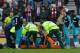 Mertesacker being attended to by the medical team at Sunderland.
