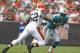 CLEVELAND, OH - SEPTEMBER 25: Wide receiver Davone Bess #15 of the Miami Dolphins runs by linebacker D'Qwell Jackson #52 of the Cleveland Browns at Cleveland Browns Stadium on September 25, 2011 in Cleveland, Ohio. (Photo by Matt Sullivan/Getty Images)
