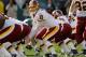 PHILADELPHIA, PA - JANUARY 01: Quarterback Rex Grossman #8 of the Washington Redskins calls a signal under center against the Philadelphia Eagles at Lincoln Financial Field on January 1, 2012 in Philadelphia, Pennsylvania. (Photo by Rob Carr/Getty Images)