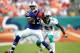 MIAMI GARDENS, FL - NOVEMBER 20: Receiver Stevie Johnson #13 of the Buffalo Bills makes a catch in front of Cornerback Vontae Davis #21 of the Miami Dolphins at Sun Life Stadium on November 20, 2011 in Miami Gardens, Florida. (Photo by Marc Serota/Getty Images)