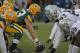 GREEN BAY, WI - DECEMBER 11: Scott Wells #63 of the Green Bay Packers prepares to snap the ball against the Oakland Raiders at Lambeau Field on December 11, 2011 in Green Bay, Wisconsin. The Packers defeated the Raiders 46-16. (Photo by Jonathan Daniel/Getty Images)