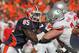 CHAMPAIGN, IL - OCTOBER 15: Whitney Mercilus #85 of the Illinois Fighting Illini rushes against Jack Mewhort #74 of the Ohio State Buckeyes at Memorial Stadium on October 15, 2011 in Champaign, Illinois. Ohio State defeated Illinois 17-7. (Photo by Jonathan Daniel/Getty Images)