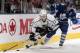 TORONTO, CANADA - DECEMBER 19: Dion Phaneuf #3 of the Toronto Maple Leafs cross checks Dustin Brown #23 of the Los Angeles Kings during NHL action at The Air Canada Centre December 19, 2011 in Toronto, Ontario, Canada. (Photo by Abelimages/Getty Images)