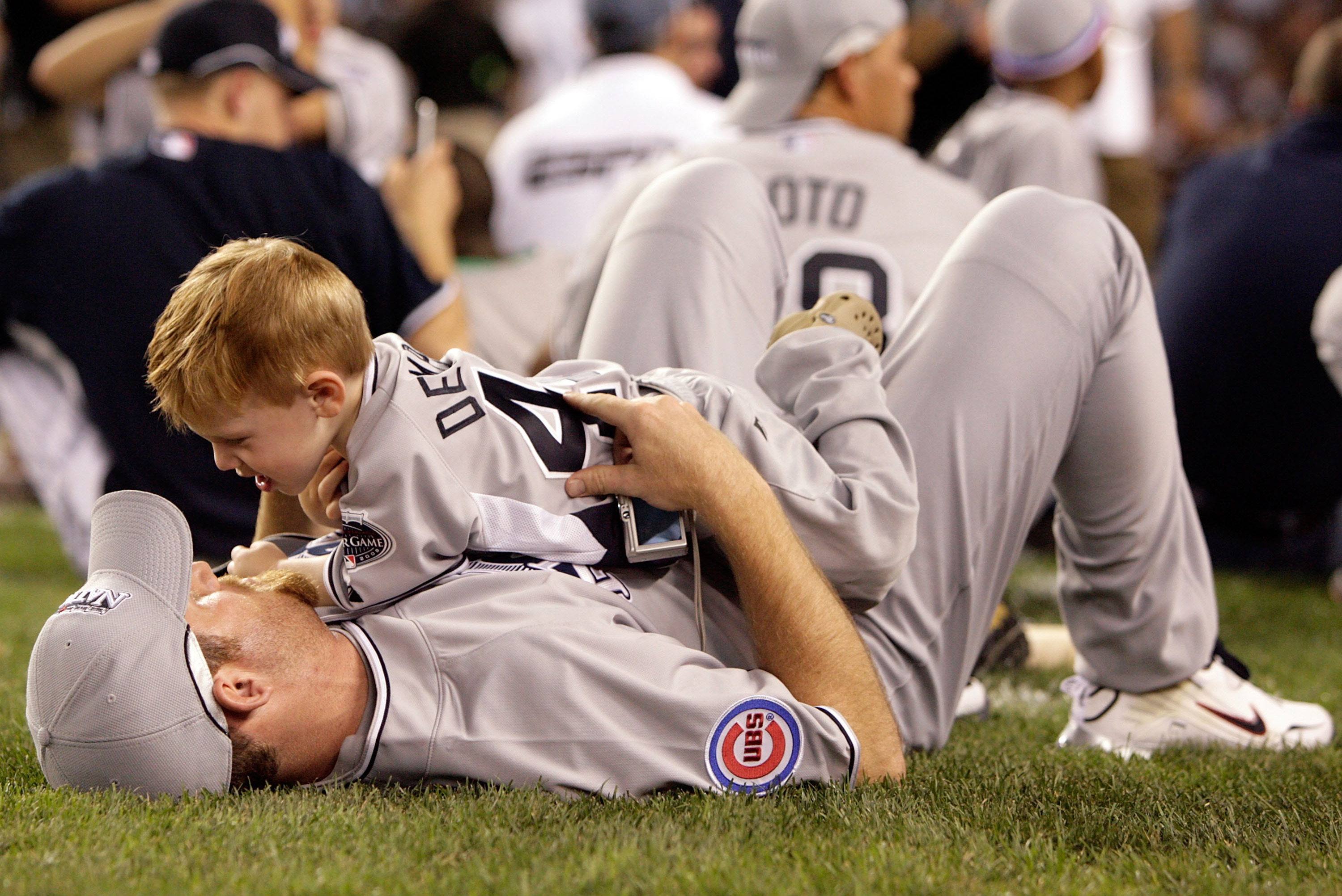 Ryan Dempster and his son stand on the field before the 2008 MLB