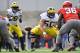 COLUMBUS, OH - NOVEMBER 27: David Molk #50 of the Michigan Wolverines blocks against the Ohio State Buckeyes at Ohio Stadium on November 27, 2010 in Columbus, Ohio. (Photo by Jamie Sabau/Getty Images)