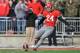 COLUMBUS, OH - NOVEMBER 27: Placekicker Drew Basil #24 of the Ohio State Buckeyes kicks off to the Michigan Wolverines at Ohio Stadium on November 27, 2010 in Columbus, Ohio. (Photo by Jamie Sabau/Getty Images)