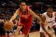LOS ANGELES, CA - DECEMBER 22: Kevin Martin #12 of the Houston Rockets reaches to control the ball in front of Eric Gordon #10 of the Los Angeles Clippers at Staples Center on December 22, 2010 in Los Angeles, California. NOTE TO USER: User expressly acknowledges and agrees that, by downloading and or using this photograph, User is consenting to the terms and conditions of the Getty Images License Agreement. (Photo by Stephen Dunn/Getty Images)