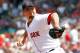 BOSTON, MA - JULY 28: Josh Beckett #19 of the Boston Red Sox throws against the Kansas City Royals at Fenway Park on July 28, 2011 in Boston, Massachusetts. (Photo by Jim Rogash/Getty Images)