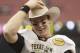 HOUSTON - DECEMBER 31: Quarterback Ryan Tannehill #17 of Texas A&M Texas A&M Aggies holds his MVP trophy after Texas A&M defeated Northwesten University 33-22 at Reliant Stadium on December 31, 2011 in Houston, Texas. (Photo by Bob Levey/Getty Images)