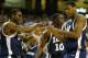 ATLANTA - MARCH 26: Teammates Lionel Chalmers #0 Romain Sato #10 and Justin Cage #3 of the Xavier Musketeers celebrate during the third round game of the NCAA Division I Men's Basketball Tournament against the Texas Longhorns at the Georgia Dome on March 26, 2004 in Atlanta, Georgia. (Photo by Jamie Squire/Getty Images)