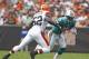 CLEVELAND, OH - SEPTEMBER 25: Wide receiver Davone Bess #15 of the Miami Dolphins runs by linebacker D'Qwell Jackson #52 of the Cleveland Browns at Cleveland Browns Stadium on September 25, 2011 in Cleveland, Ohio. (Photo by Matt Sullivan/Getty Images)