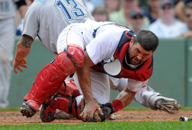 njured Red Sox catcher Jason Varitek has some fun with his daughter News  Photo - Getty Images