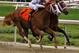 El Padrino drives past Mark Valeski in the final yards. SEE VIDEO BELOW