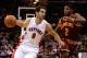 CLEVELAND, OH - DECEMBER 26: Jose Calderon #8 of the Toronto Raptors drives to the basket against Kyrie Irving #2 of the Cleveland Cavaliers during the season opener at Quicken Loans Arena on December 26, 2011 in Cleveland, Ohio. NOTE TO USER: User expressly acknowledges and agrees that, by downloading and/or using this Photograph, user is consenting to the terms and conditions of the Getty Images License Agreement. (Photo by Mike Lawrie/Getty Images)