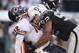 OAKLAND, CA - NOVEMBER 27: Richard Seymour #92 of the Oakland Raiders hits Caleb Hanie #12 of the Chicago Bears after Hanie threw the ball at O.co Coliseum on November 27, 2011 in Oakland, California. (Photo by Ezra Shaw/Getty Images)
