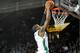 Dennis Tinnon dunks the ball during Marshall's big win over the Golden Eagles of Southern Miss (credit Rick Haye/Marshall University)