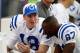 ORCHARD PARK, NY - NOVEMBER 23: Quarterback Peyton Manning #18 and wide receiver Reggie Wayne #87 of the Indianapolis Colts confer on the bench during the game against the Buffalo Bills on November 23, 2003 at Ralph Wilson Stadium in Orchard Park, New York. The Colts defeated the Bills 17-14. (Photo by Rick Stewart/Getty Images)