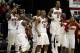 ATLANTA, GA - MARCH 08: Players from the North Carolina State Wolfpack including Richard Howell #1, DeShawn Painter #0, C.J. Williams #21 and Lorenzo Brown #2 of the North Carolina State Wolfpack celebrate late in the second half against the Boston College Eagles during their first round game of 2012 ACC Men's Basketball Conferene Tournament at Philips Arena on March 8, 2012 in Atlanta, Georgia. (Photo by Streeter Lecka/Getty Images)