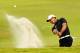 MIAMI, FL - MARCH 08: Tiger Woods hits out of the bunker on the fourth hole during the first round of the 2012 World Golf Championships Cadillac Championship at Doral Golf Resort And Spa on March 8, 2012 in Miami, Florida. (Photo by Mike Ehrmann/Getty Images)