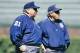 Harry Wendelstedt (left) wore No. 21 throughout his NL career. His son Hunter, a current MLB umpire, has worn No. 21 since 1999 in honor of his father.