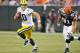CLEVELAND, OH - AUGUST 13: Brian Schaefering #91 of the Cleveland Browns pursues Matt Flynn #10 of the Green Bay Packers during the second quarter at Cleveland Browns Stadium on August 13, 2011 in Cleveland, Ohio. The Browns defeated the Packers 27-17. (Photo by Jason Miller/Getty Images)