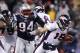 FOXBORO, MA - JANUARY 14: Shaun Ellis #94 of the New England Patriots sackes Tim Tebow #15 of the Denver Broncos during their AFC Divisional Playoff Game at Gillette Stadium on January 14, 2012 in Foxboro, Massachusetts. (Photo by Elsa/Getty Images)