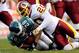 PHILADELPHIA, PA - JANUARY 01: Oshiomogho Atogwe #20 of the Washington Redskins tackles Dion Lewis #28 of the Philadelphia Eagles during a game at Lincoln Financial Field on January 1, 2012 in Philadelphia, Pennsylvania. (Photo by Patrick McDermott/Getty Images)