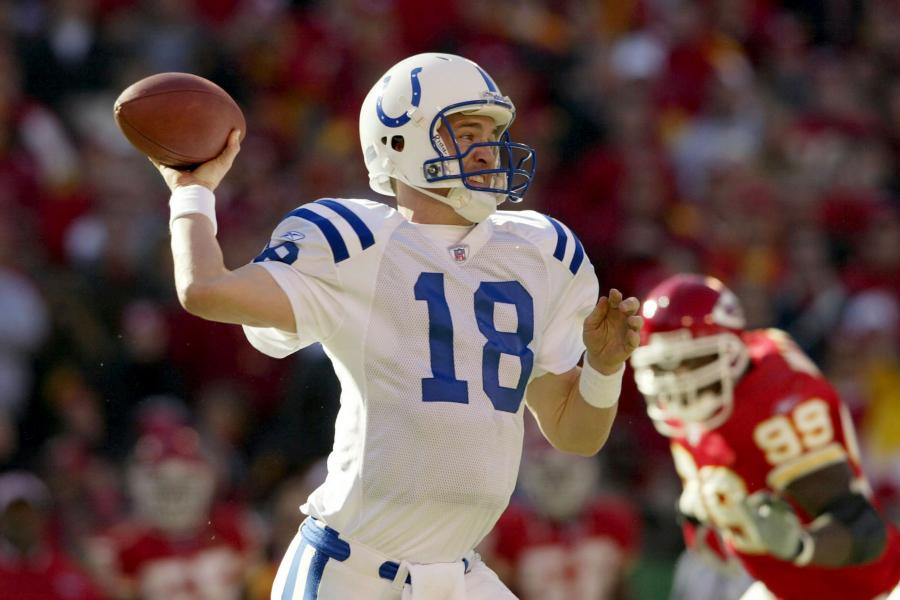 Why is Peyton Manning wearing his helmet in the training room? 