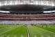 HOUSTON, TX - JANUARY 07: A general view of the empty stands as players warm up and stretch prior to the Houston Texans hosting the Cincinnati Bengals during their 2012 AFC Wild Card Playoff game at Reliant Stadium on January 7, 2012 in Houston, Texas. (Photo by Thomas B. Shea/Getty Images)