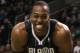 BOSTON, MA - JANUARY 17: Dwight Howard #12 of the Orlando Magic smiles on the baseline as he waits for Shaquille O'Neal of the Boston Celtics to shoot a free throw on January 17, 2011 at the TD Garden in Boston, Massachusetts. NOTE TO USER: User expressly acknowledges and agrees that, by downloading and/or using this Photograph, User is consenting to the terms and conditions of the Getty Images License Agreement. (Photo by Elsa/Getty Images)