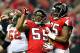 ATLANTA, GA - JANUARY 01: John Abraham #55 and Jonathan Babineaux #95 of the Atlanta Falcons celebrate after Abraham's sack and fumble recovery against the Tampa Bay Buccaneers during play at the Georgia Dome on January 1, 2012 in Atlanta, Georgia. (Photo by Grant Halverson/Getty Images)