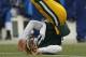 GREEN BAY, WI - JANUARY 01: Matt Flynn #10 of the Green Bay Packers flips on his back after being hit against the Detroit Lions at Lambeau Field on January 1, 2012 in Green Bay, Wisconsin. The Packers defeated the Lions 45-41. (Photo by Jonathan Daniel/Getty Images)