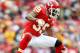 KANSAS CITY, MO - DECEMBER 18: Brandon Carr #39 of the Kansas City Chiefs leaps over a sliding quarterback Aaron Rodgers #12 of the Green Bay Packers during the game on December 18, 2011 at Arrowhead Stadium in Kansas City, Missouri. (Photo by Jamie Squire/Getty Images)