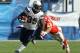 SAN DIEGO, CA - SEPTEMBER 25: Running back Mike Tolbert #35 of the San Diego Chargers carries the ball past safety Sabby Piscitelli #42 of the Kansas City Chiefs at Qualcomm Stadium on September 25, 2011 in San Diego, California. The Chargers won 20-17. (Photo by Stephen Dunn/Getty Images)