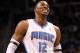 ORLANDO, FL - MARCH 13: Dwight Howard #12 of the Orlando Magic smiles during the game against the Miami Heat at Amway Center on March 13, 2012 in Orlando, Florida. NOTE TO USER: User expressly acknowledges and agrees that, by downloading and or using this photograph, User is consenting to the terms and conditions of the Getty Images License Agreement. (Photo by Sam Greenwood/Getty Images)