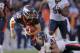DENVER, CO - DECEMBER 11: Tim Tebow #15 of the Denver Broncos is tackled by Chris Conte #47 of the Chicago Bears after getting a first down at Sports Authority Field at Mile High on December 11, 2011 in Denver, Colorado. (Photo by Doug Pensinger/Getty Images)