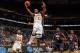 NEW ORLEANS, LA - MARCH 09: Trae Golden #11 of the Tennessee Volunteers is fouled as he shoots the ball by Ladarius White #10 of the Mississippi Rebels during the quarterfinals of the SEC Men's Basketball Tournament at the New Orleans Arena on March 9, 2012 in New Orleans, Louisiana. (Photo by Chris Graythen/Getty Images)