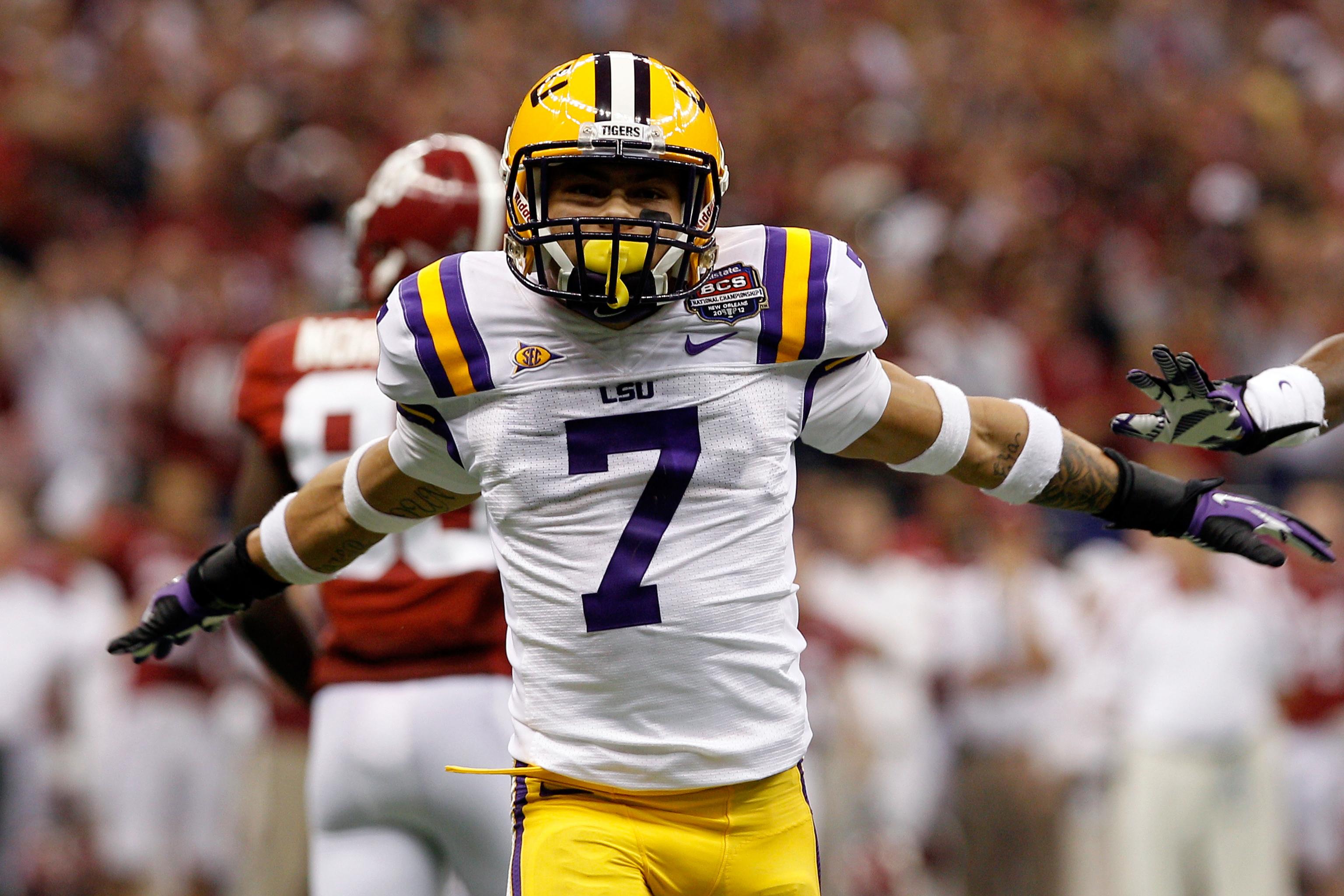 Joe Burrow LSU Tigers Unsigned White Jersey Celebrates Touchdown Photograph