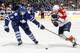TORONTO, CANADA - FEBRUARY 28: Luke Schenn #2 of the Toronto Maple Leafs pokes at the feet of Sean Bergenheim #20 of the Florida Panthers during NHL action at the Air Canada Centre February 28, 2012 in Toronto, Ontario, Canada. (Photo by Abelimages/Getty Images)