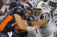 DENVER, CO - NOVEMBER 17: Quarterback Tim Tebow #15 of the Denver Broncos rushes against Mike DeVito #70 of the New York Jets at Sports Authority Field at Mile High on November 17, 2011 in Denver, Colorado. The Broncos defeated the Jets 17-13. (Photo by Doug Pensinger/Getty Images)
