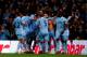 MANCHESTER, ENGLAND - MARCH 21: Samir Nasri (unshirted) of Manchester City is congratulated by teammates after scoring his team's second goal during the Barclays Premier League match between Manchester City and Chelsea at the Etihad Stadium on March 21, 2012 in Manchester, England. (Photo by Laurence Griffiths/Getty Images)