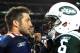 DENVER, CO - NOVEMBER 17: Tim Tebow #15 of the Denver Broncos talks with Mark Sanchez #6 of the New York Jets following the game at Sports Authority Field at Mile High on November 17, 2011 in Denver, Colorado. (Photo by Garrett W. Ellwood/Getty Images)