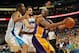 NEW ORLEANS, LA - MARCH 14: Kobe Bryant #24 of the Los Angeles Lakers looks to pass the ball around Trevor Ariza #1 and Marco Belinelli #8 of the New Orleans Hornets at the New Orleans Arena on March 14, 2012 in New Orleans, Louisiana. The Lakers defeated the Hornets 107-101. NOTE TO USER: User expressly acknowledges and agrees that, by downloading and or using this photograph, User is consenting to the terms and conditions of the Getty Images License Agreement. (Photo by Chris Graythen/Getty Images)