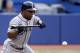 TORONTO, CANADA - JULY 19: Chone Figgins #9 of the Seattle Mariners bunts against the Toronto Blue Jays during MLB action at The Rogers Centre July 19, 2011 in Toronto, Ontario, Canada. (Photo by Abelimages/Getty Images)