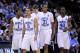 NEWARK, NJ - MARCH 25: Dexter Strickland #1, Kendall Marshall #5, John Henson #31 and Harrison Barnes #40 of the North Carolina Tar Heels walk on the court after a play against the Marquette Golden Eagles during the east regional semifinal of the 2011 NCAA Men's Basketball Tournament at the Prudential Center on March 25, 2011 in Newark, New Jersey. (Photo by Chris Trotman/Getty Images)